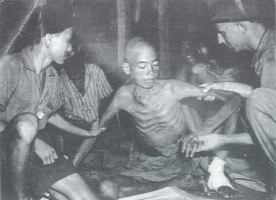 Javanese Ramusha labourer receiving medical attention from Capt. Don Wilhelm of the Australian 2/13 Field Ambulance. Used as slave labour, denied food, some four thousand died of beatings and starvation in the Miri and Seria oilfields. 